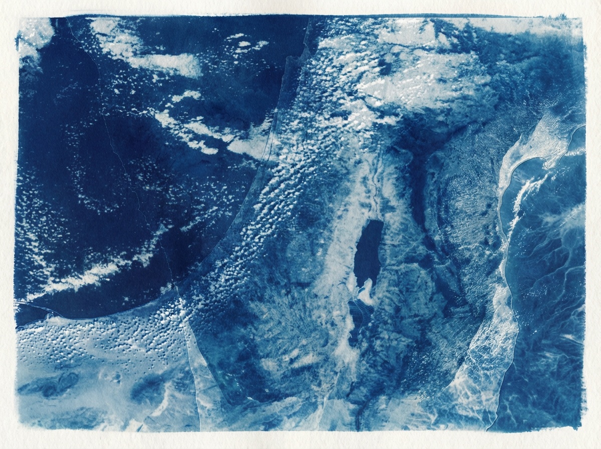 A cyanotype of layered landscape, blue tones on paper
